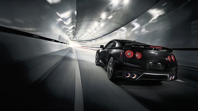 2023 Nissan GT-R seen from behind driving through a tunnel | Nissan of Pittsfield in Pittsfield MA